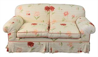 Two cushion sofa in floral upholstery, length of sofa 67 inches.