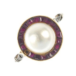 A gem-set ring. The mabe pearl, within a calibre-cut ruby surround, to the diamond point shoulders a