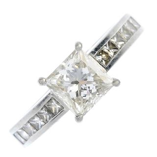 A platinum diamond single-stone ring. The square-shape diamond, weighing 0.92ct, to the similarly-cu