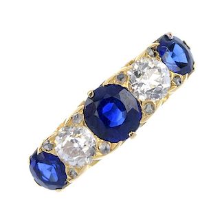 A sapphire and diamond five-stone ring. The alternating circular-shape sapphire and old-cut diamond