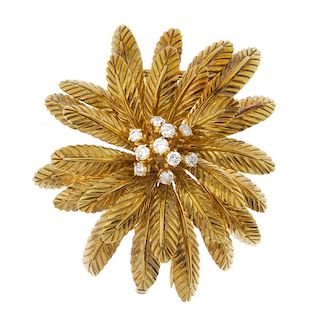 A mid 20th century diamond floral brooch. The brilliant-cut diamond scattered cluster, within a seri