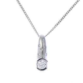 A set of platinum diamond jewellery. The pendant designed as a brilliant-cut diamond with textured t