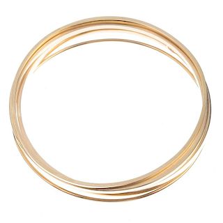 A selection of four bangles. To include four variously sized plain bangles. Widths 4 to 1mms. Inner