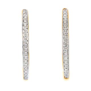 A pair of 18ct gold diamond earrings. Each designed as a brilliant-cut diamond line, to the curved p