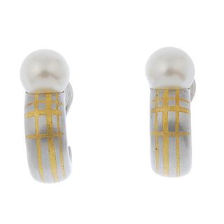 BOODLE & DUNTHORNE - a pair of platinum cultured pearl earrings. Each designed as a cultured pearl,