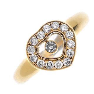 CHOPARD - an 18ct gold 'Happy Diamonds' ring. The free-moving brilliant-cut diamond collet, within a