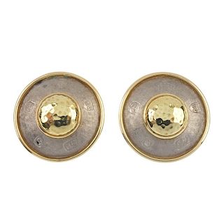 ELIZABETH GAGE - a pair of 18ct gold earrings. Each designed as the hammered dome, to the bi-colour