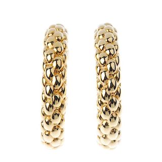 FOPE - a pair of 18ct gold ear hoops. Each designed as a brick motif curved line. Signed Fope. Hallm