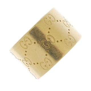 GUCCI - an 18ct gold 'Icon' band ring. The wide band, decorated with signature double 'G' motif and
