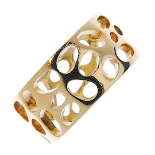 LINKS OF LONDON - an 18ct gold dress ring. Designed as a wide band, with pierced oval detail. Sponso