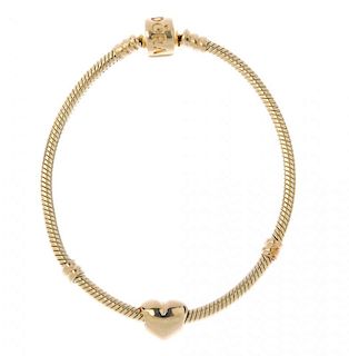 PANDORA - a charm bracelet. The snake-link chain, with heart-shape charm. Sponsor's mark for Pandora