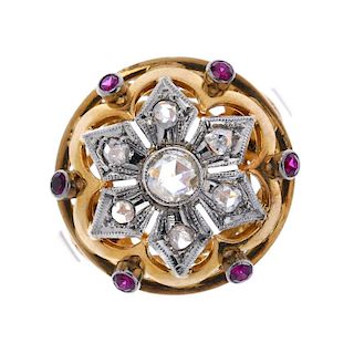 A diamond and synthetic ruby floral dress ring. The rose-cut diamond collet, within a similarly-cut