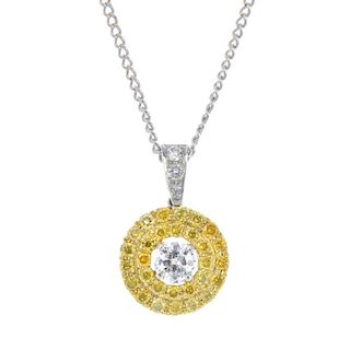 A coloured diamond and diamond pendant with chain. The old-cut diamond, within a similarly-cut 'yell