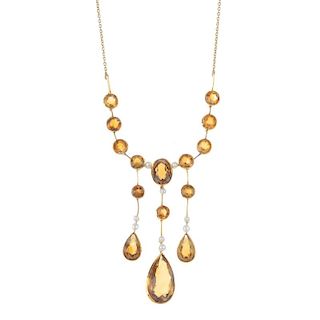 A citrine and seed pearl necklace. Designed as three graduated pear and circular-shape citrine drops