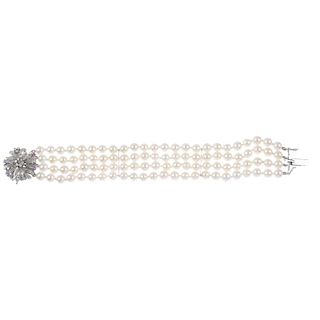A cultured pearl four-row bracelet. Comprising four strands of twenty-four cultured pearls, measurin