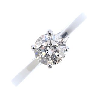 A platinum diamond single-stone ring. The brilliant-cut diamond, to the crossover gallery and plain