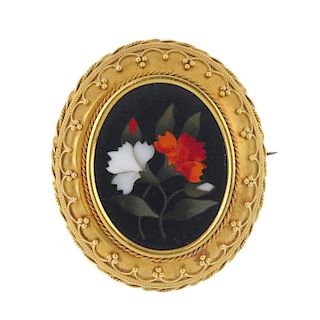 A late 19th century gold pietra dura brooch. Of foliate design, the pietra dura panel, within a cane