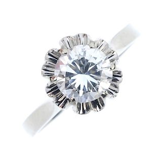 A diamond single-stone ring. The brilliant-cut diamond, within an illusion surround, to the plain ba