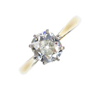 A mid 20th century 18ct gold diamond single-stone ring. The old-cut diamond, to the tapered shoulder