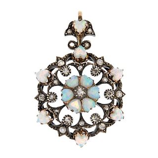 A late 19th century silver and 15ct gold opal and diamond pendant. The old-cut diamond and heart-sha