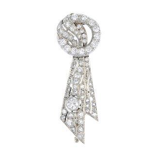 An early 20th century diamond brooch. The brilliant-cut diamond wreath, to the intertwined single an