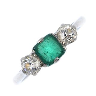 An emerald and diamond three-stone ring. The square-shape emerald, with old-cut diamond sides, to th