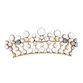 A moonstone brooch. Designed as a stylised coronet, with graduated circular moonstone cabochons thro