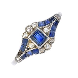 An early 20th century platinum, sapphire and diamond ring. The rectangular-shape sapphire and single