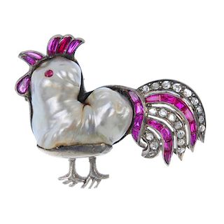 A gem-set novelty brooch. Designed as a cockerel, the baroque pearl body, with ruby facial detail, t