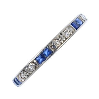 A mid 20th century sapphire and diamond full-circle eternity ring. Designed as a series of alternati