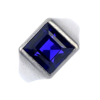 A gentleman's early 20th century platinum natural colour change sapphire signet ring. The square-sha