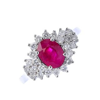 An 18ct gold glass-filled ruby and diamond dress ring.  Of marquise- shape outline, The oval-shape g