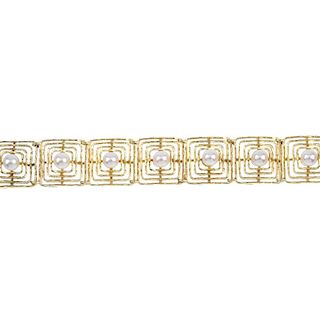 A cultured pearl bracelet. Of openwork design, the series of cultured pearls, each within a square-s