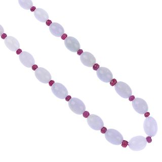 A jadeite and ruby single-strand necklace. Comprising a series of thirty oval-shape jadeite beads, m
