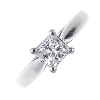A platinum diamond single-stone ring. The square-shape diamond, weighing 0.71ct, to the tapered shou