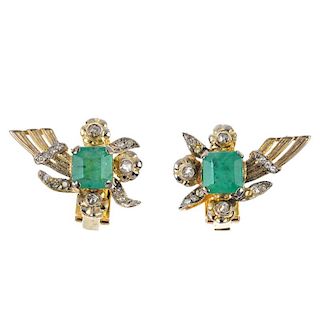 A pair of emerald and diamond ear clips. Each designed as a square-shape emerald, within an old and