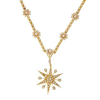An early 20th century 15ct gold seed and split pearl necklace. The split pearl star with floral spac