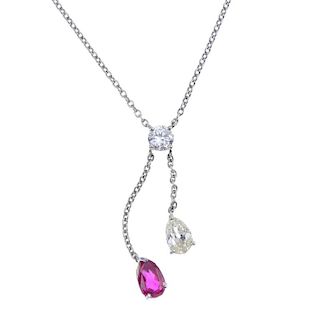 A ruby and diamond pendant. Designed as pear-shape ruby and diamond graduated drops, suspended from