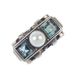 A mid 20th century cultured pearl and synthetic spinel three-stone ring. The cultured pearl, to the
