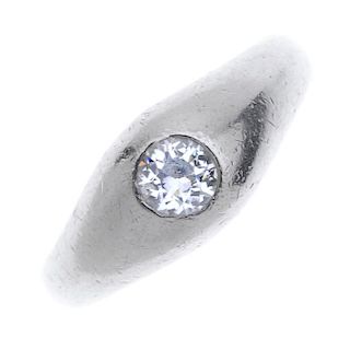 A mid 20th century platinum diamond single-stone ring.  The old-cut diamond, inset to the tapered ba