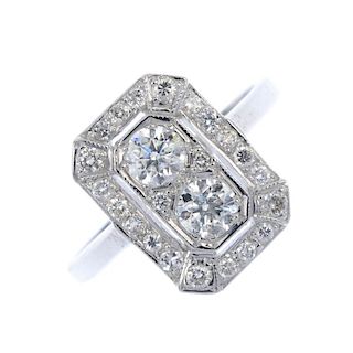 A diamond dress ring. Of geometric design, the two brilliant-cut diamonds, within a brilliant-cut di