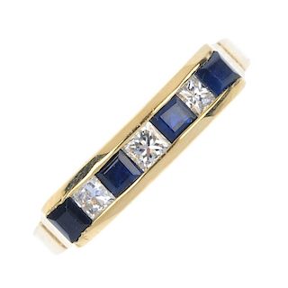 An 18ct gold sapphire and diamond ring. The alternating square-shape diamond and sapphire line, to t