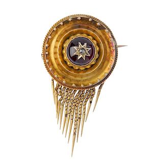 A late 19th century gold garnet and diamond brooch. Of circular outline, the rose-cut diamond star,