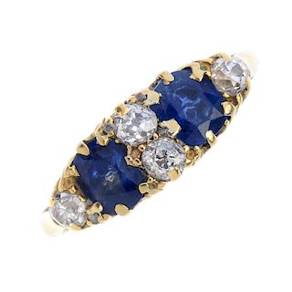 An early 20th century 18ct gold sapphire and diamond dress ring. The two oval-shape sapphires, inter