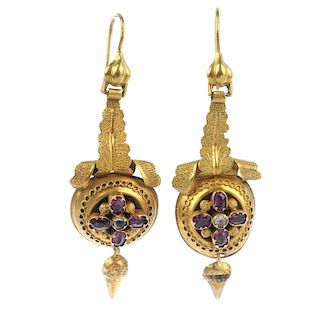 A pair of mid 19th century gold gem-set ear pendants. Each designed as an oval-shape garnet quatrefo