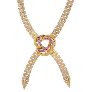 A 1960s 9ct gold ruby necklace. The textured fancy-link chain, with circular-shape ruby crescent wre