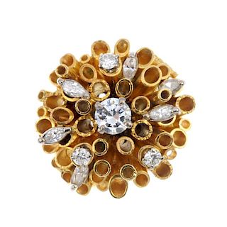 A mid 20th century 18ct gold diamond dress ring. The brilliant-cut diamond and tubular surround, wit