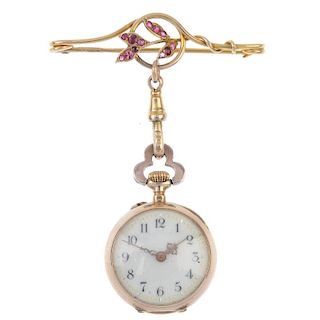 An early 20th century gold fob watch. The cream dial with black Arabic numerals and gilt minute trac