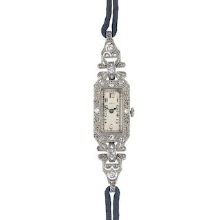 An early 20th century 18ct gold diamond cocktail watch. The rectangular-shape dial, with black Arabi