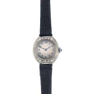 A lady's early 20th century diamond manual wind cocktail watch. The silvered dial, with black Arabic